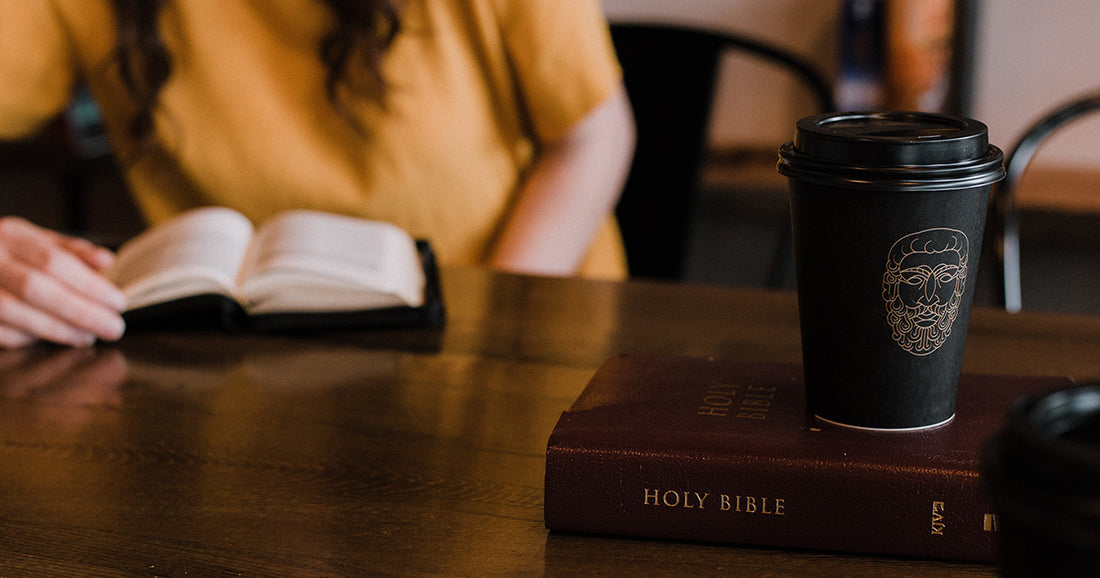Woman reading the bible with coffee cup