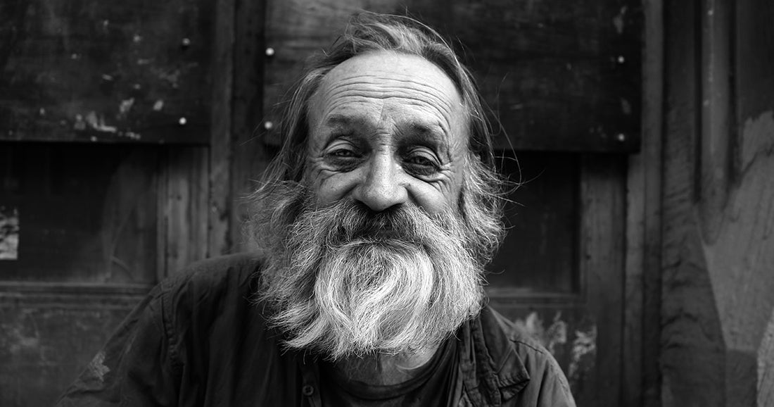black and white photo of older man with beard