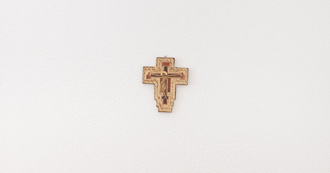crucifix hanging on a white wall