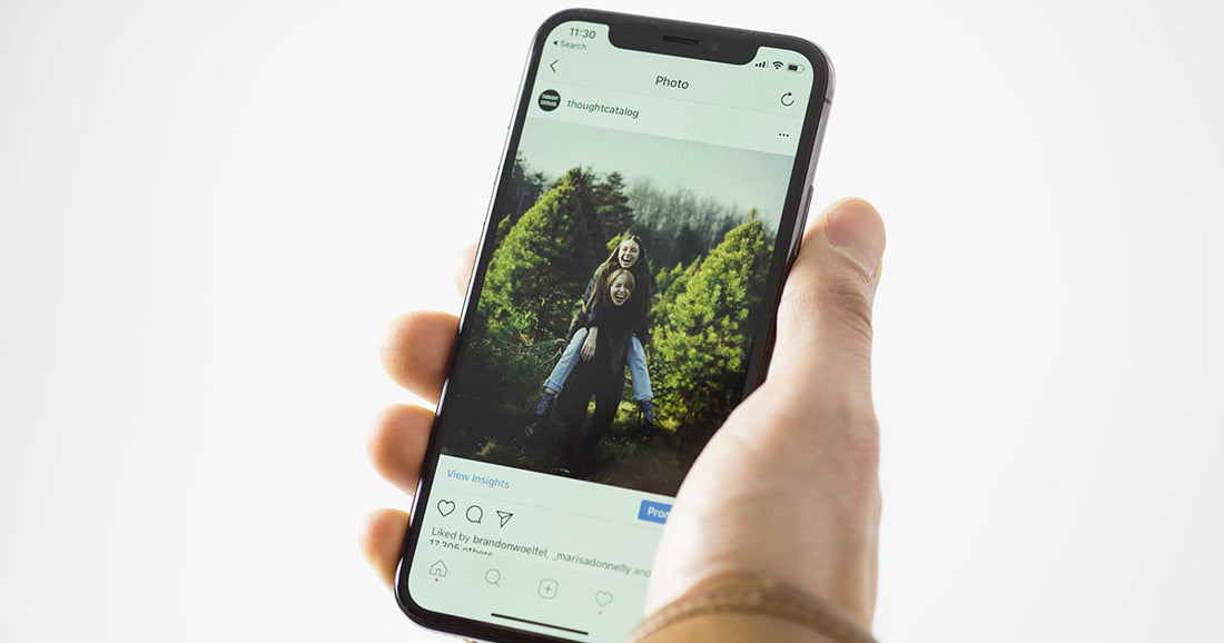 person looking at Instagram photo on their phone