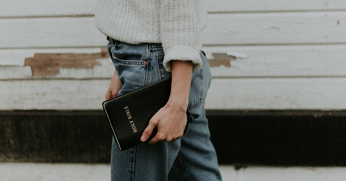 person holding bible