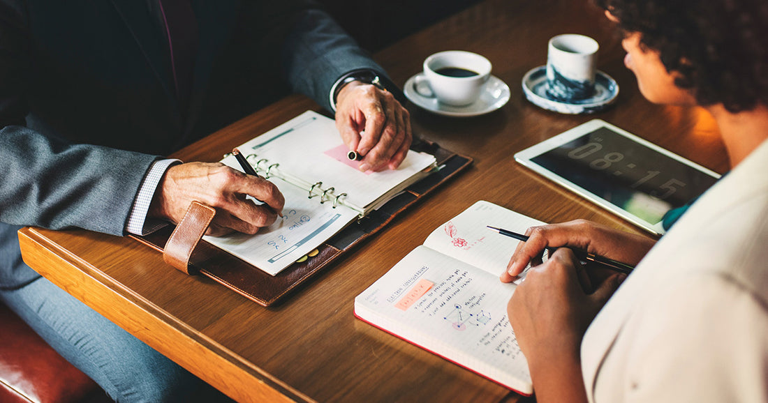 two people planning at a meeting