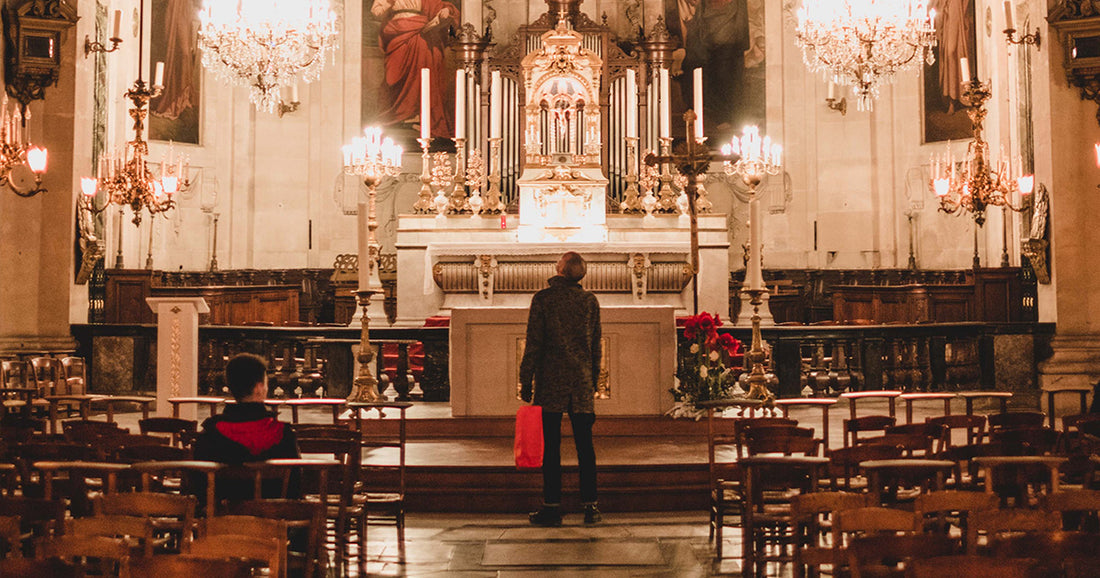 person looking around a Catholic church