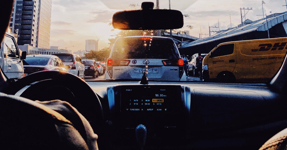 person in a car stuck in traffic