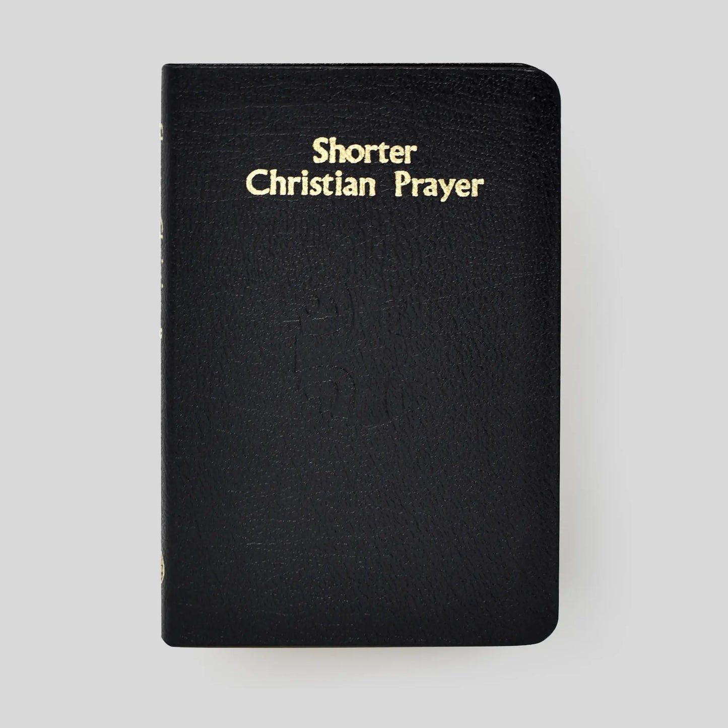 Black book titled 'Shorter Christian Prayer' on a light gray background