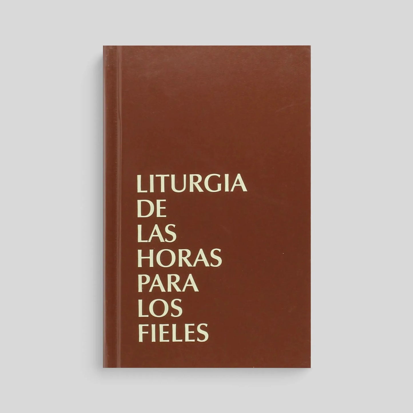 Brown book with "Liturgia de Las Horas Para Los Fieles" on the cover