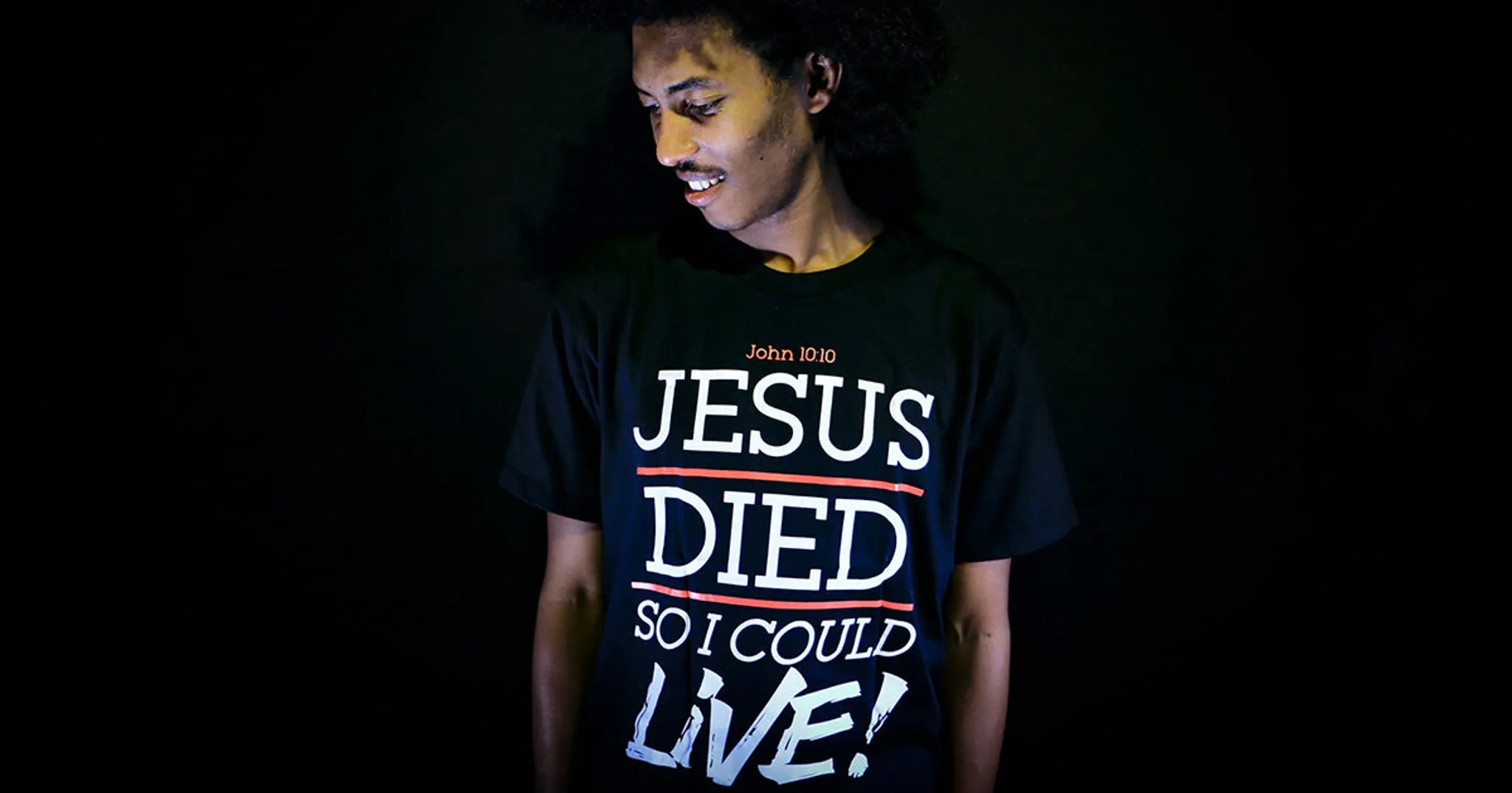 man wearing a shirt with statement about Jesus