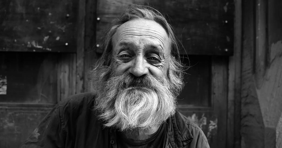 black and white photo of older man with beard