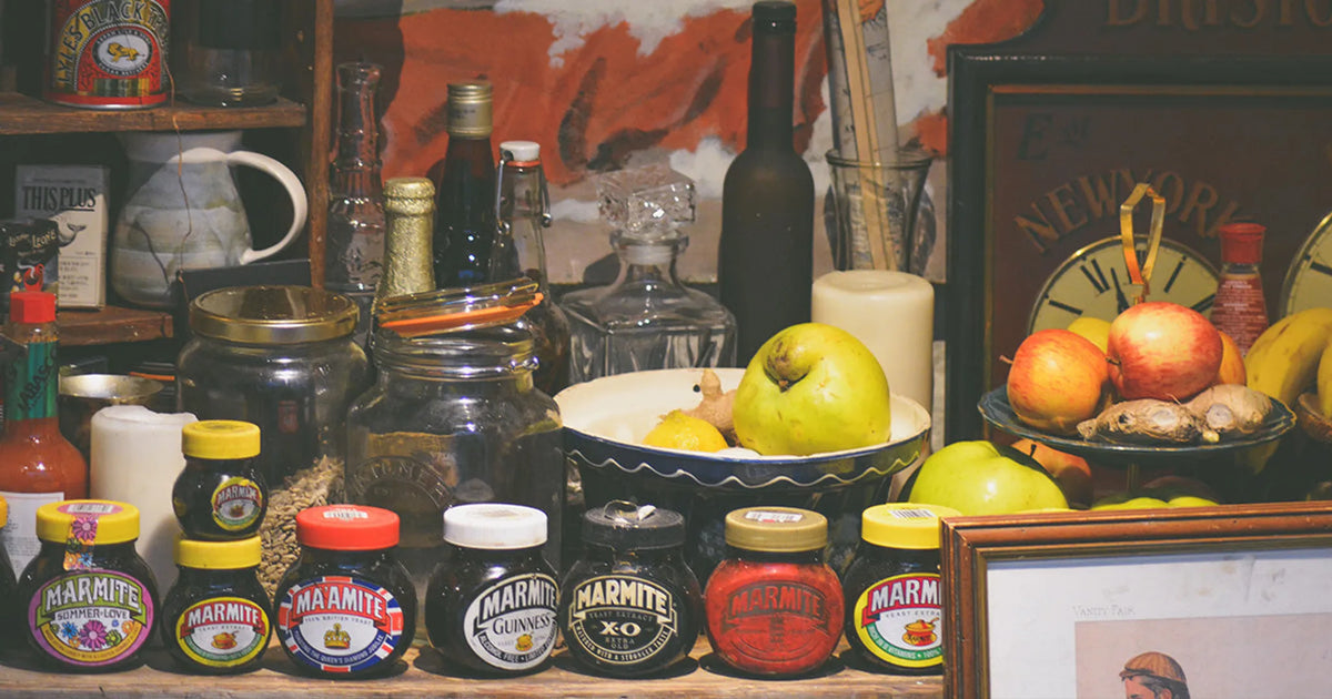 cluttered kitchen with bottles and food