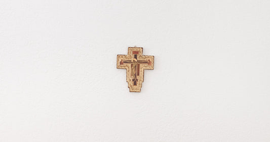 crucifix hanging on a white wall