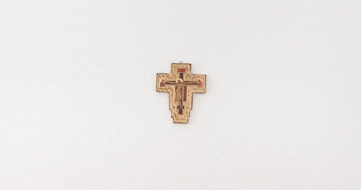 crucifix hanging on a white wall