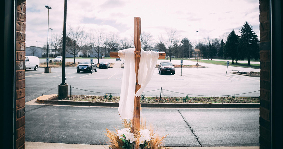 cross draped with white cloth for Holy Week