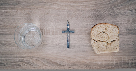bread, water, and a crucifix