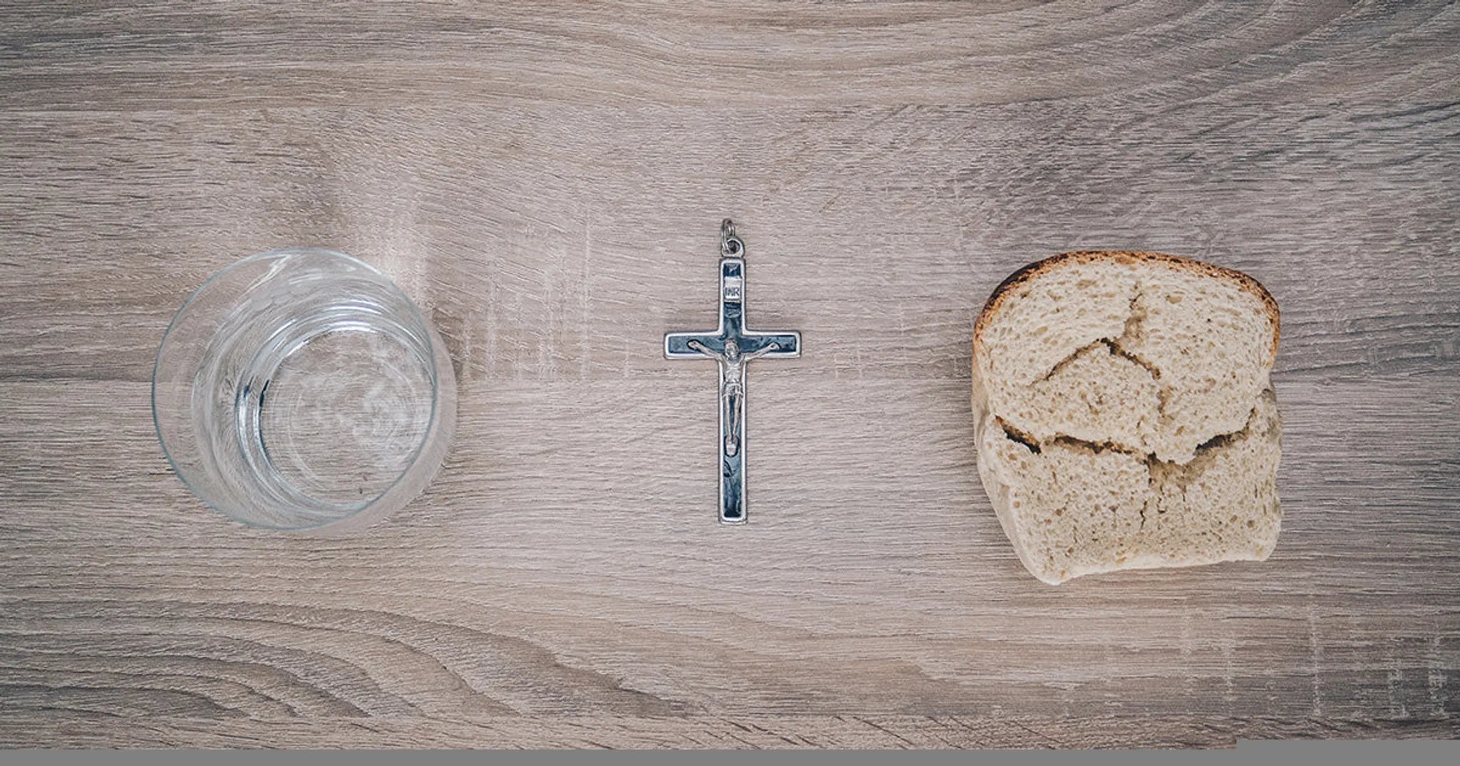 bread, water, and a crucifix