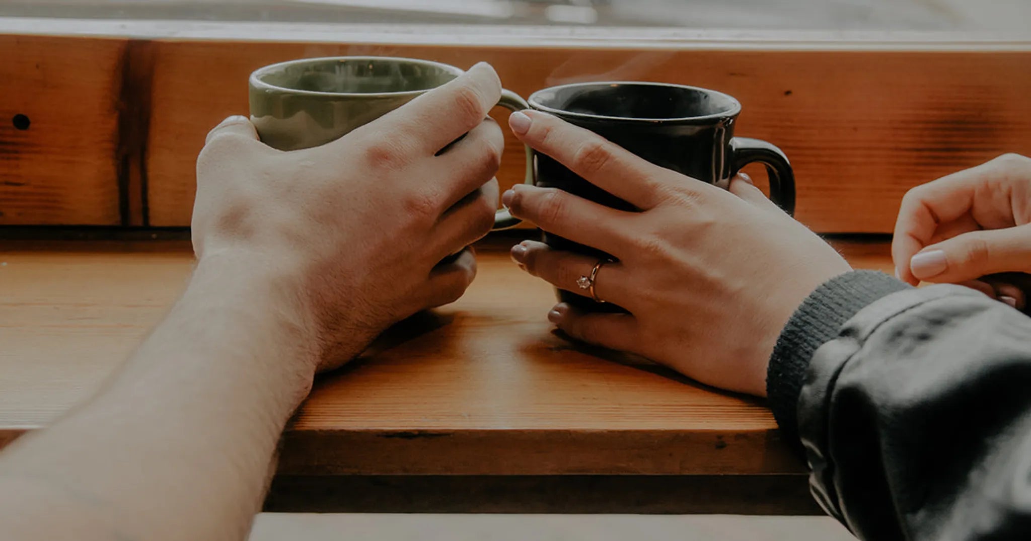 man and wife drinking coffee together