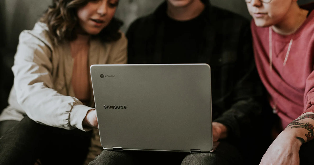 people looking at a computer