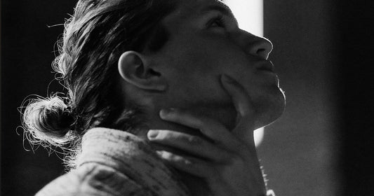 black and white photo of a person looking up