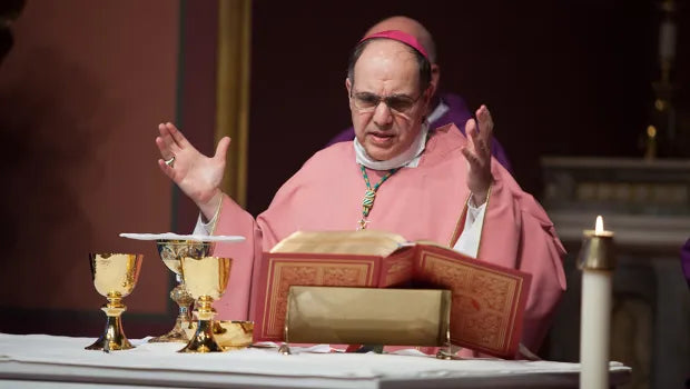 priest in pink/rose