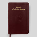 Red book titled 'Shorter Christian Prayer' on a light gray background
