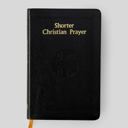 Black book titled 'Shorter Christian Prayer' on a light gray background