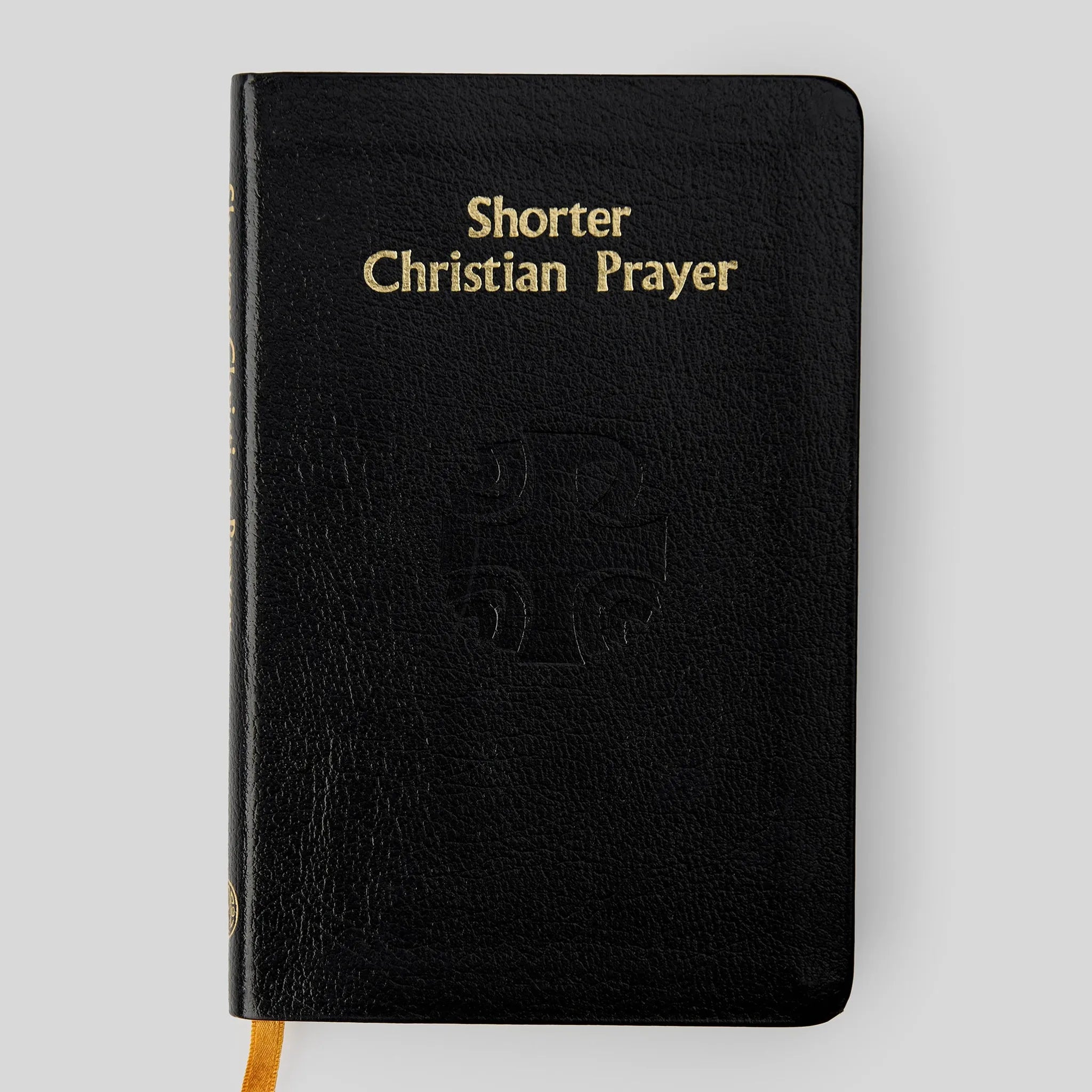 Black book titled 'Shorter Christian Prayer' on a light gray background