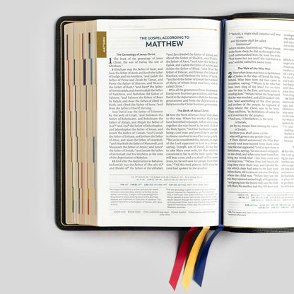 Open Bible to the Gospel of Matthew on a light gray background