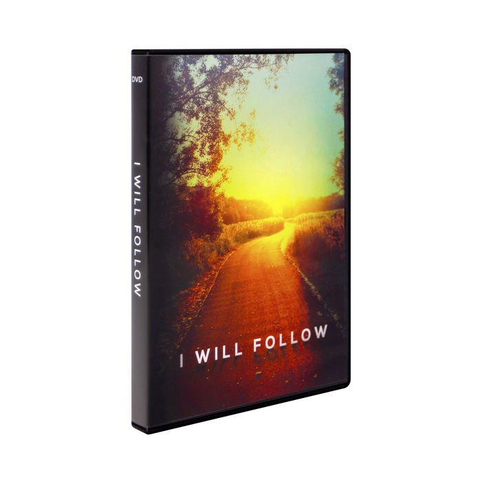 The DVD case for I Will Follow by Ascension featuring Fr. Mike Schmitz and Fr. Josh Johnson. The cover features a bright sunlit road with beautiful red, gold, and blue colors.