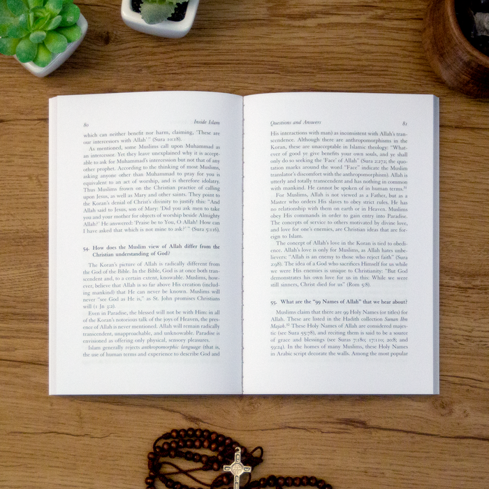A tabletop lifestyle shot of the catholic book, Inside Islam: A Guide for Catholics by Daniel Ali and Robert Spencer published by Ascension, sitting open on a wooden table next to a rosary.