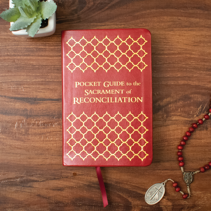 Pocket Guide to the Sacrament of Reconciliation cover on wooden table